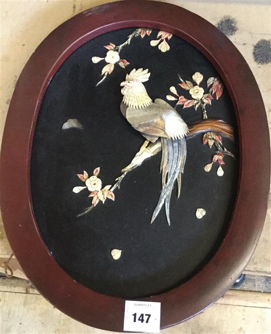 Oriental  Cockeral in an oval wooden frame